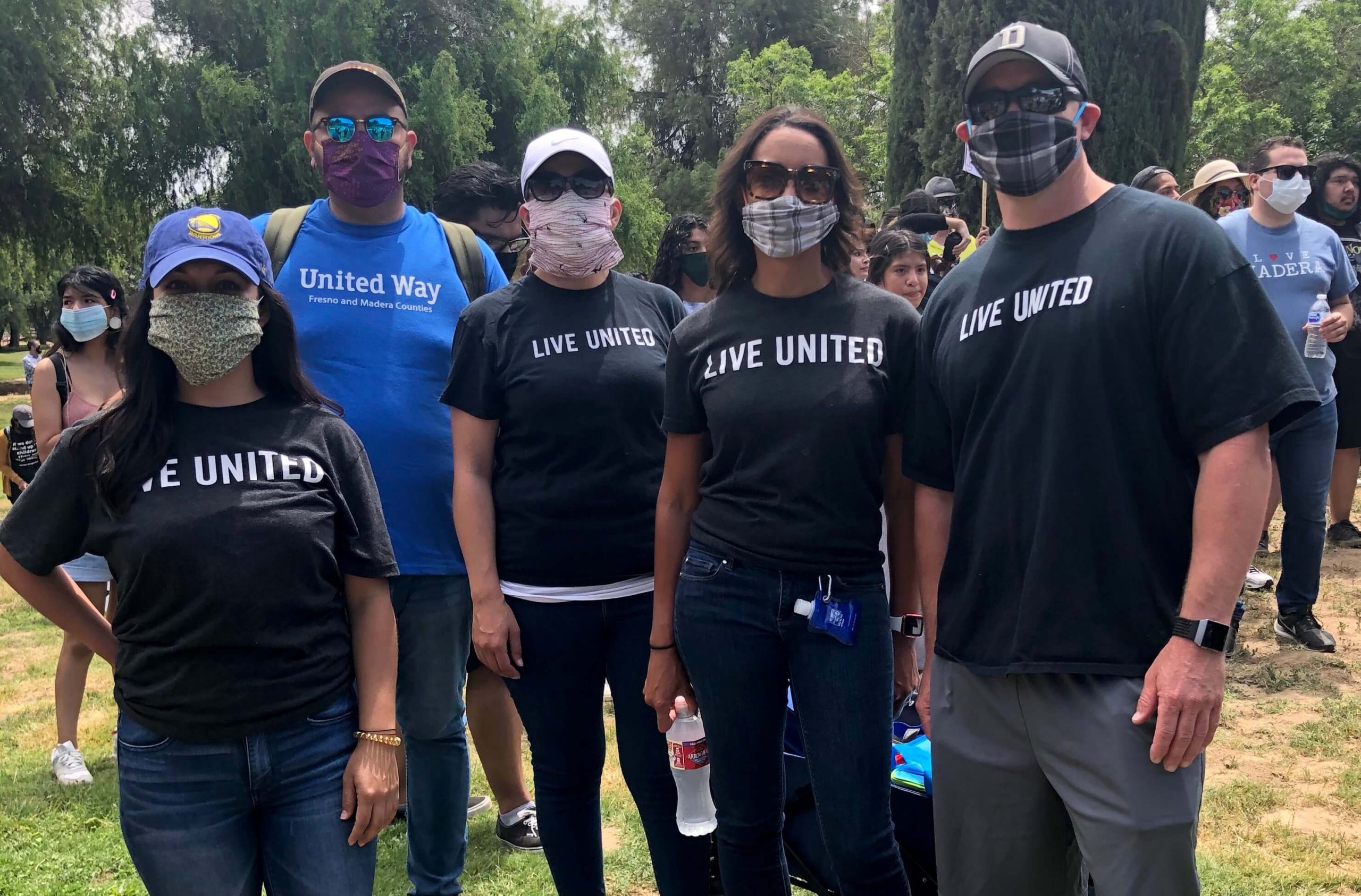 Group picture of United Way Fresno and Madera Counties staff facing camera wearing Live United T-shirts
