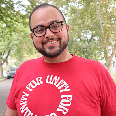 Portrait of Miguel Gastelum wearing a red shirt