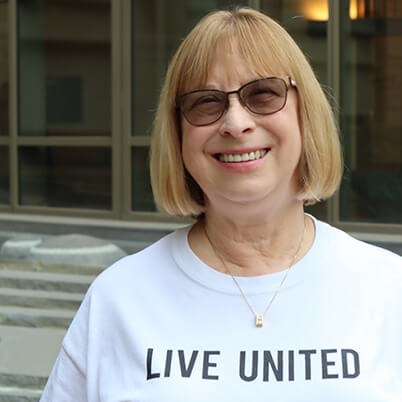 Portrait of Susan Good wearing a Live United shirt